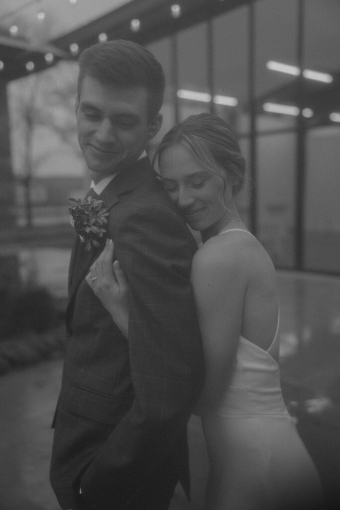 bride and groom outdoor wedding portraits in the city during their winter wedding day