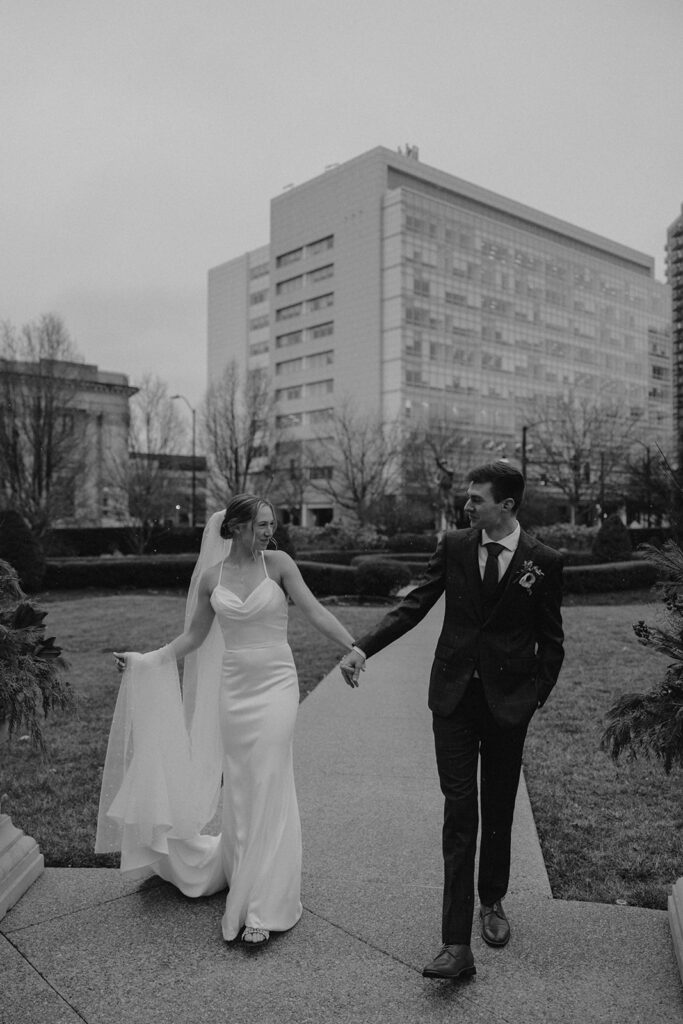 bride and groom outdoor wedding portraits in the city during their winter wedding day