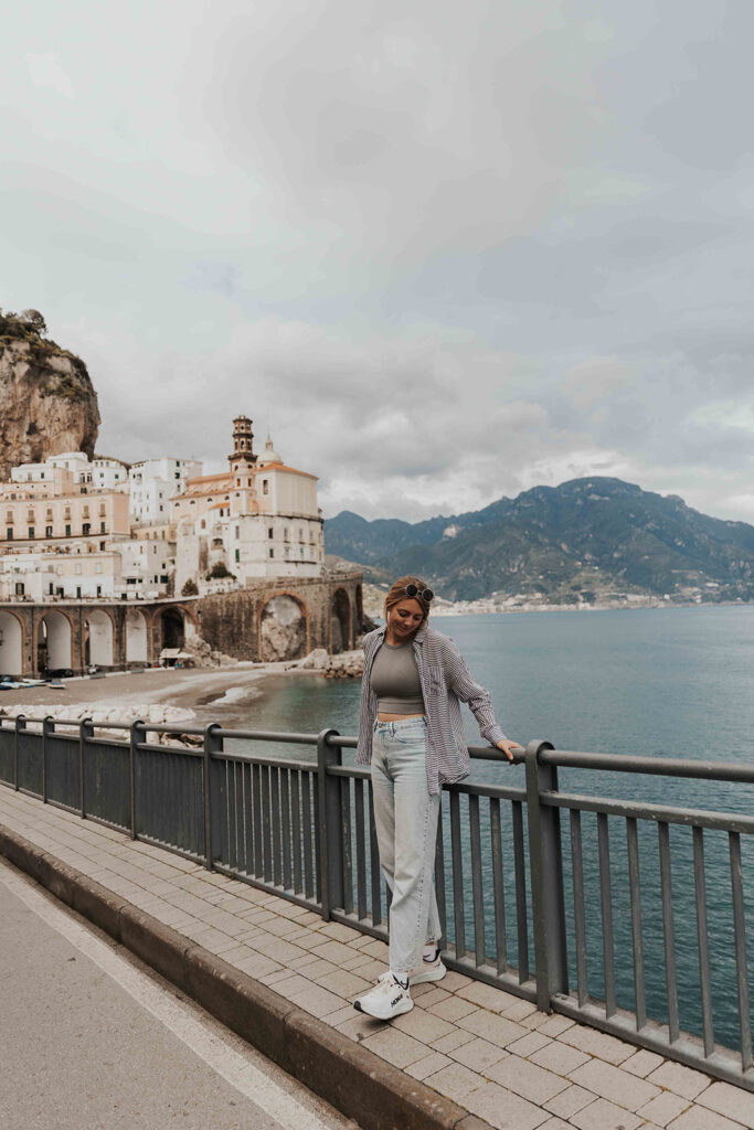 a girl posing with the Mediterranean Sea in the backdrop