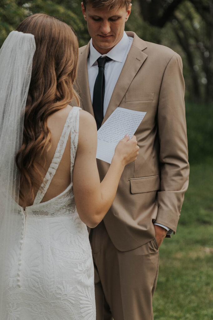 bride and groom exchanging private vows during first look