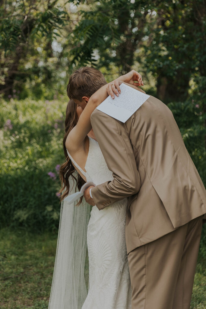 bride and groom exchanging private vows during first look