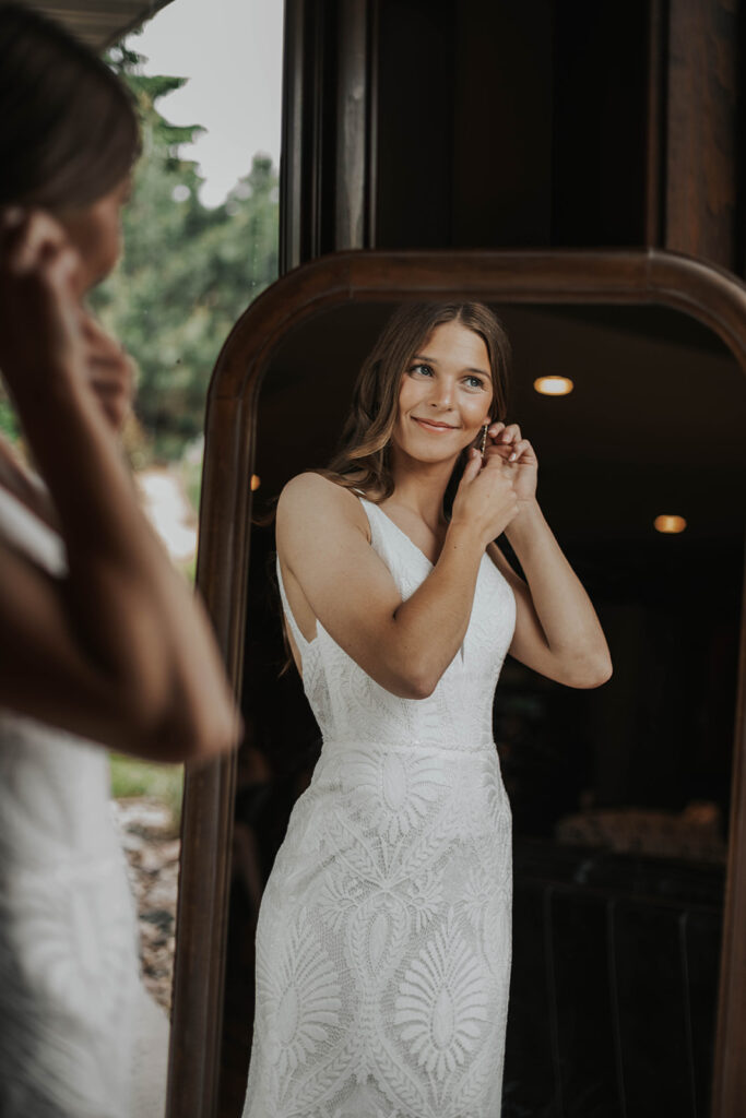 bride getting ready photos by a window