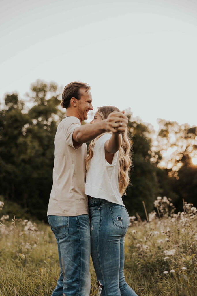 playful and romantic field engagement photos in Sibley State Park, MN