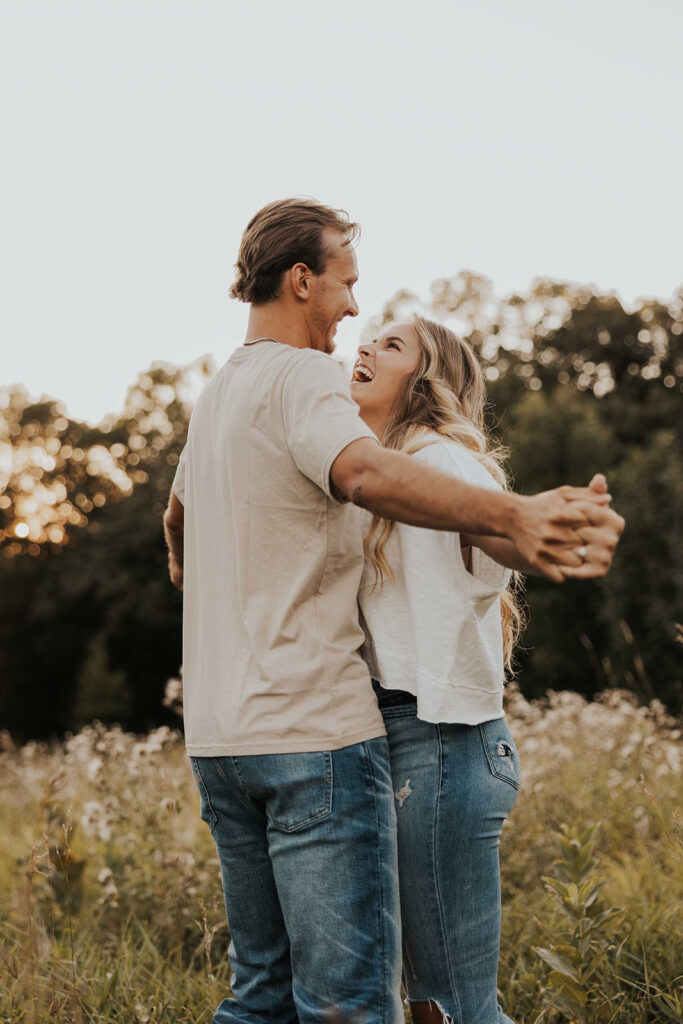 playful and romantic field engagement photos in Sibley State Park, MN