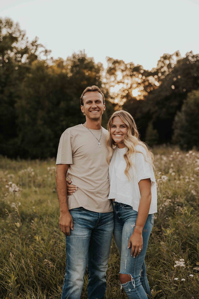 playful and romantic field engagement photos in Sibley State Park, MN