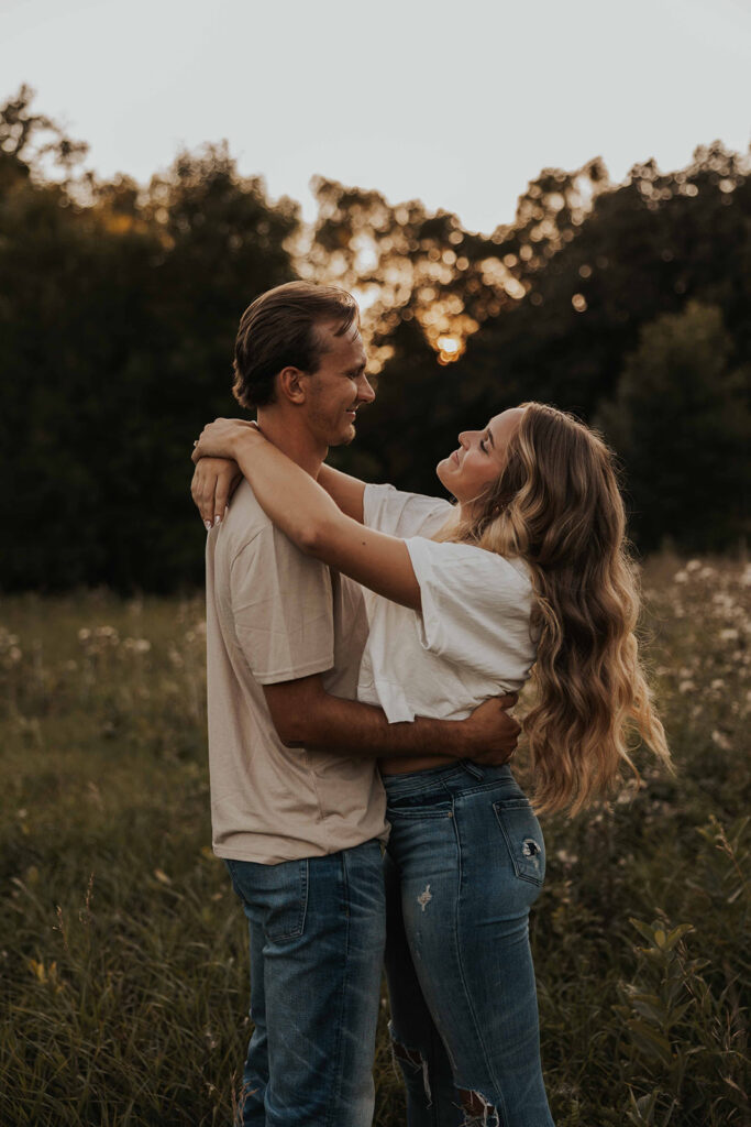 playful and romantic field engagement photos in Sibley State Park, MN