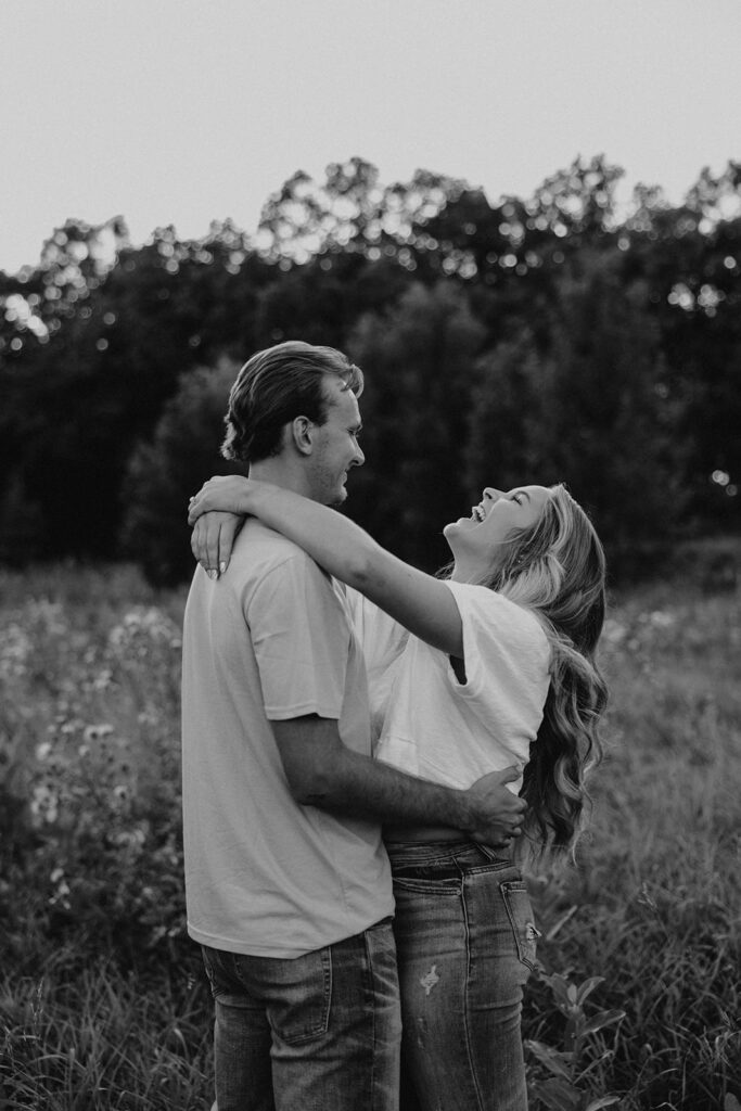 playful and romantic field engagement photos in Sibley State Park, MN