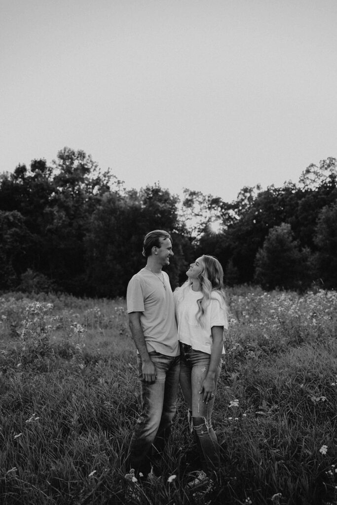 playful and romantic field engagement photos in Sibley State Park, MN