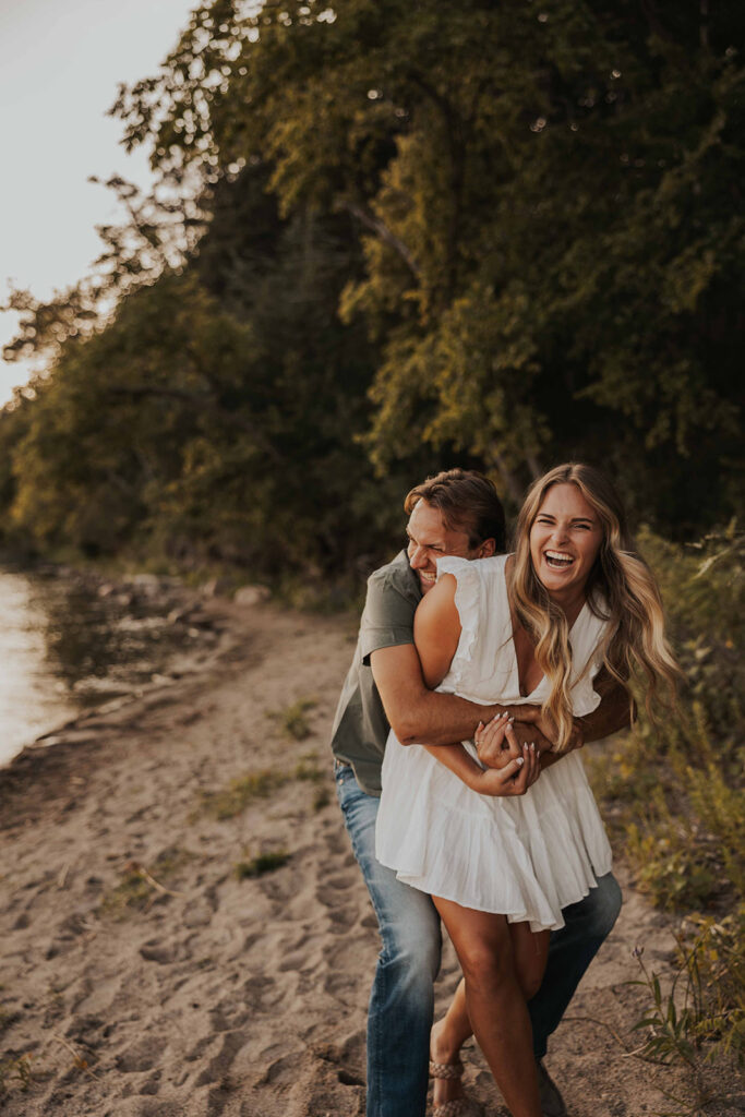 playful and romantic waterfront engagement photos in sibley state park, mn