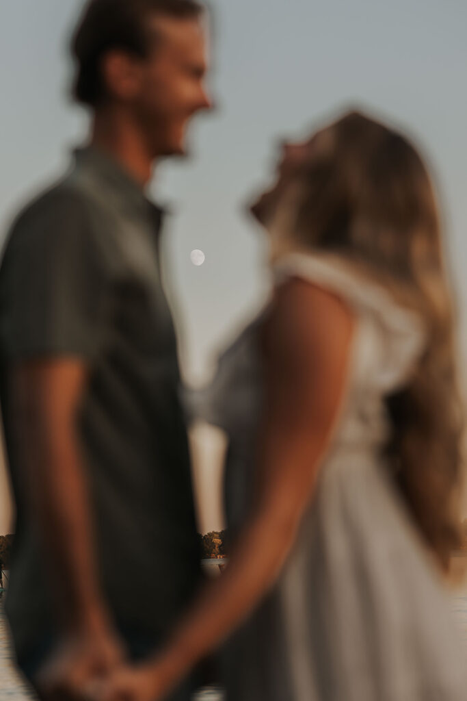 romantic engagement photo in the water