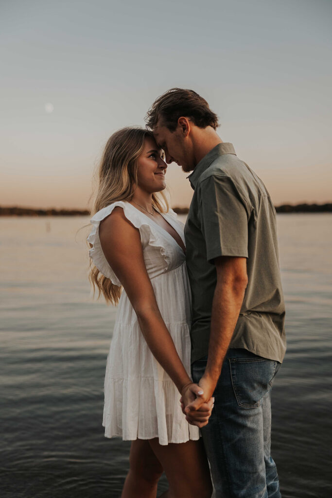 romantic engagement photo in the water