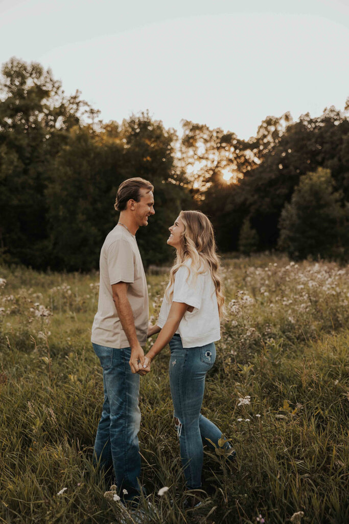 playful and romantic field engagement photos in Sibley State Park, MN