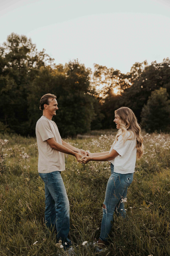 playful and romantic field engagement photos in Sibley State Park, MN