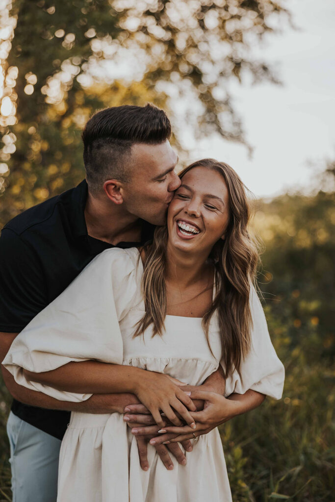 candid and romantic future bride and groom celebrating their love at their engagement photo location