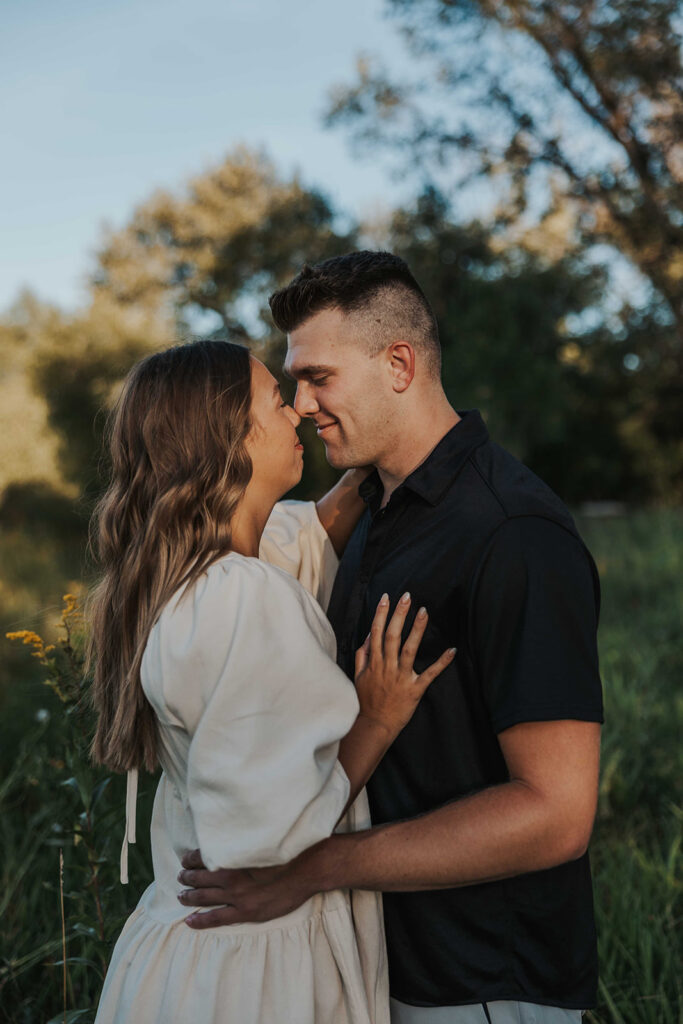 candid and romantic future bride and groom celebrating their love at their engagement photo location