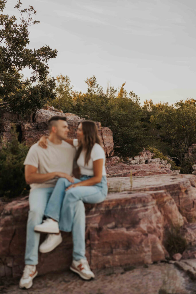 casual and adventurous couple at their engagement photo location in Blue Mounds State Park