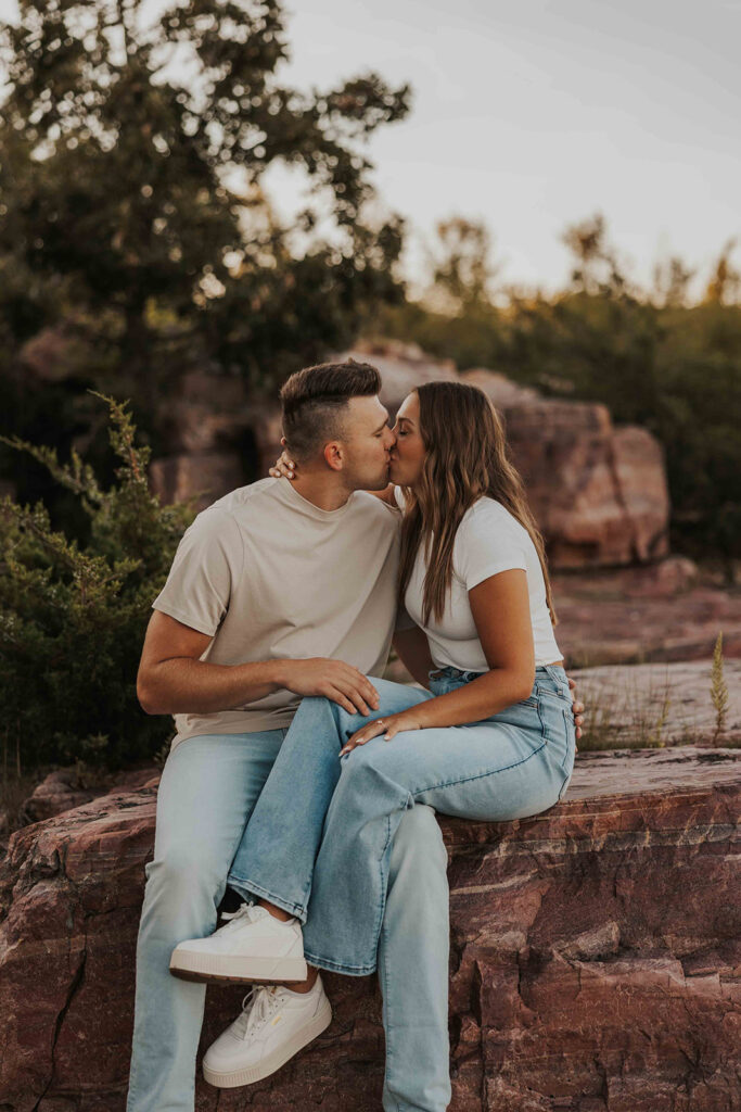 casual and adventurous couple at their engagement photo location in Blue Mounds State Park