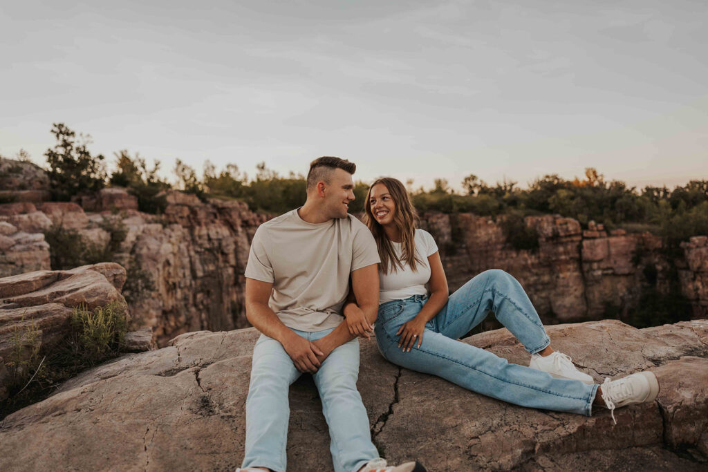 casual and adventurous couple at their engagement photo location in Blue Mounds State Park