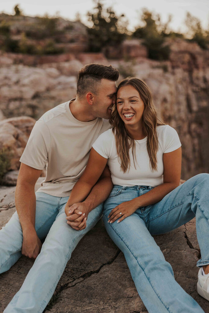 candid and romantic future bride and groom celebrating their love at their engagement photo location