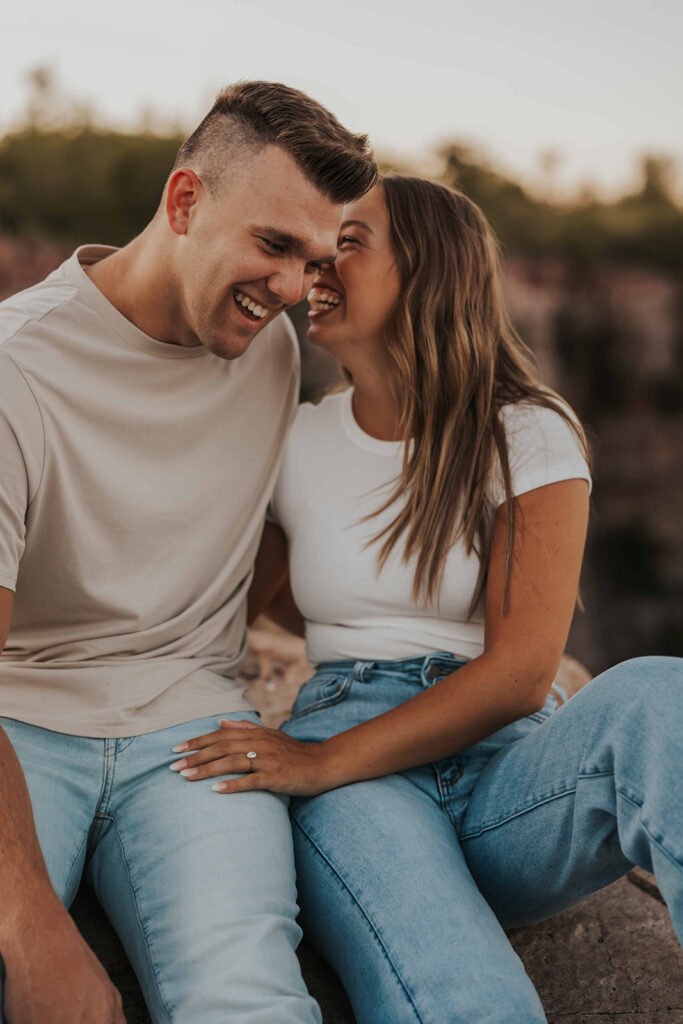 candid and romantic future bride and groom celebrating their love at their engagement photo location