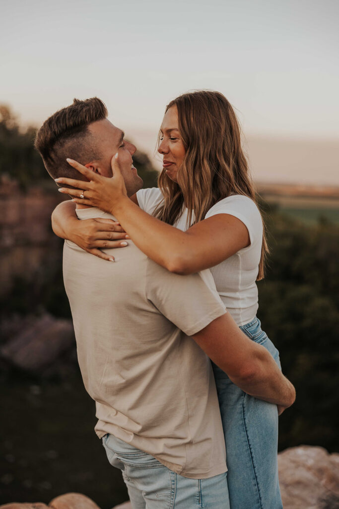 candid and romantic future bride and groom celebrating their love at their engagement photo location