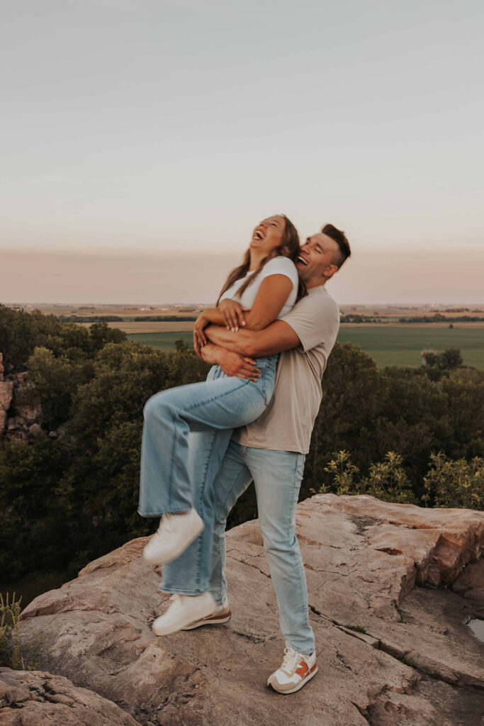 candid and romantic future bride and groom celebrating their love at their engagement photo location