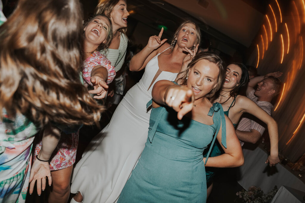 bride dancing and having fun with her guests during the wedding reception party