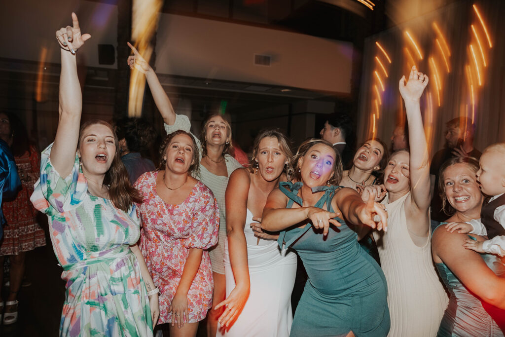 bride dancing and having fun with her guests during the wedding reception party