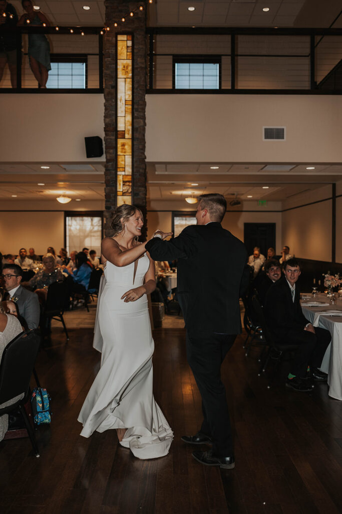 bride and groom having fun during their first dance