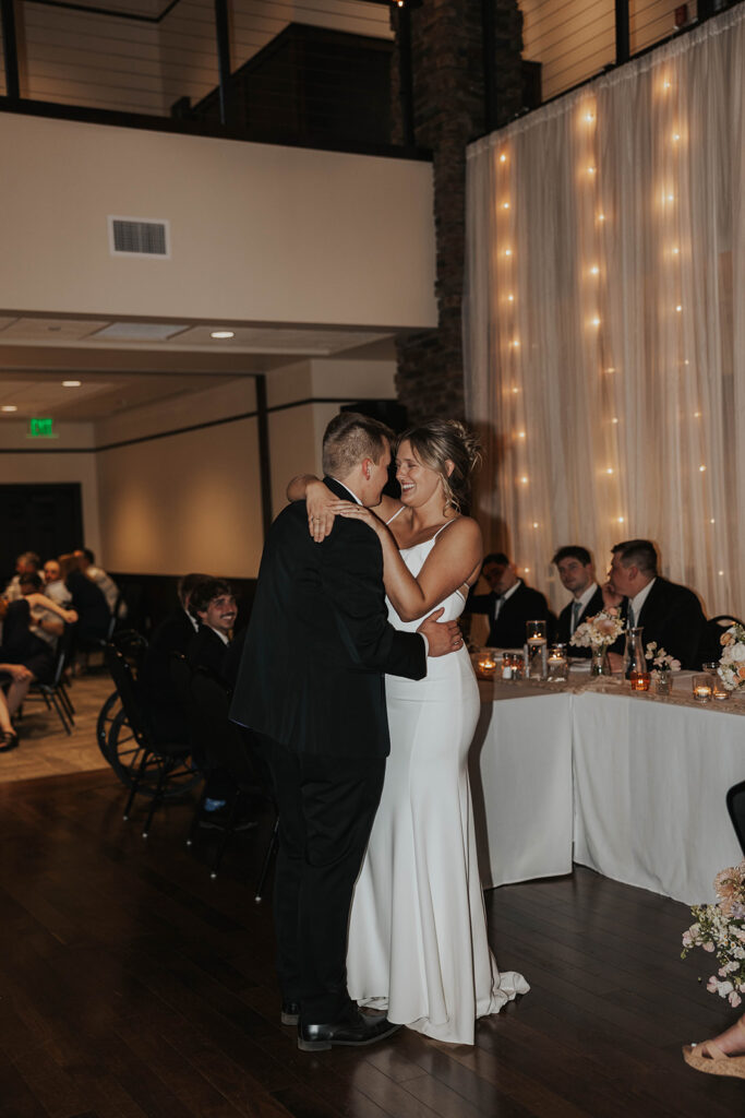 bride and groom having fun during their first dance