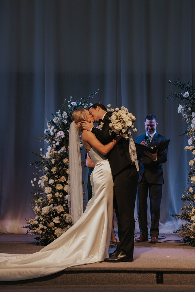 bride and groom first kiss at the ceremony