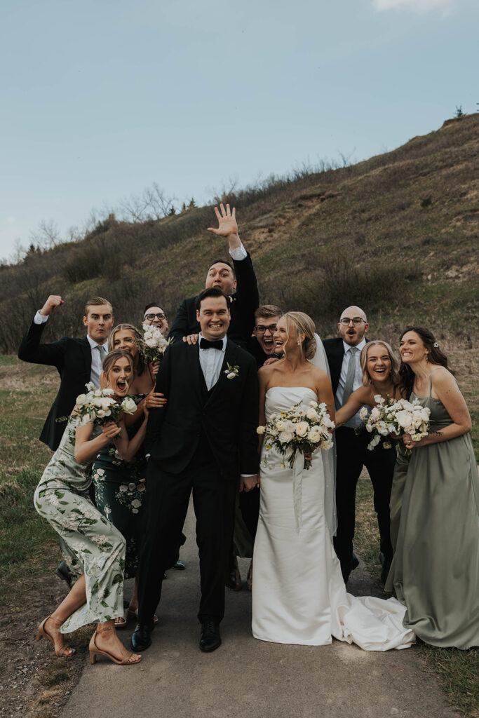 fun wedding couple and wedding party photo