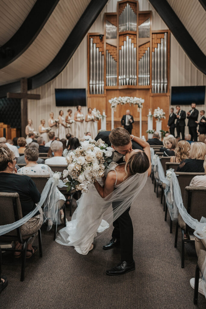 bride and groom kiss after the ceremony