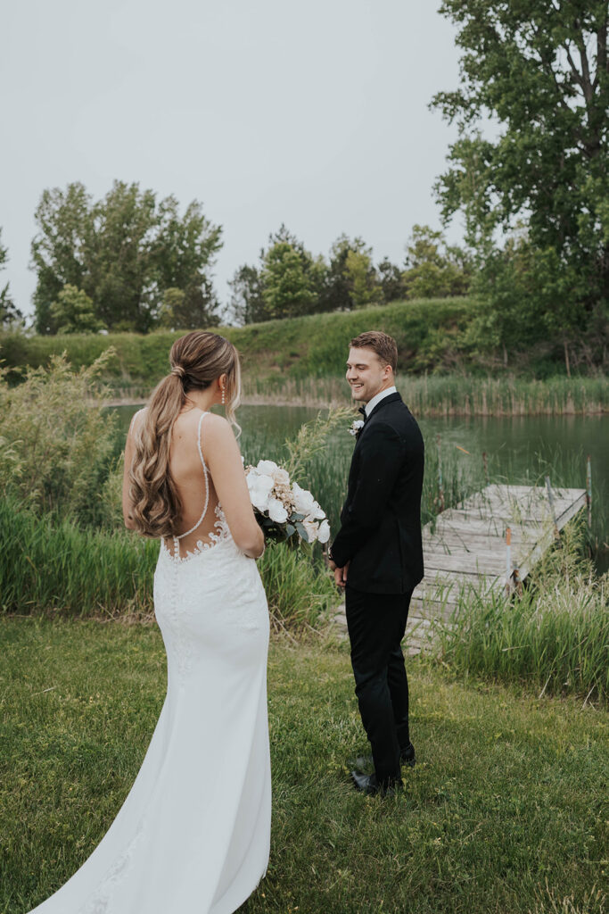 emotional bride and groom wedding first look