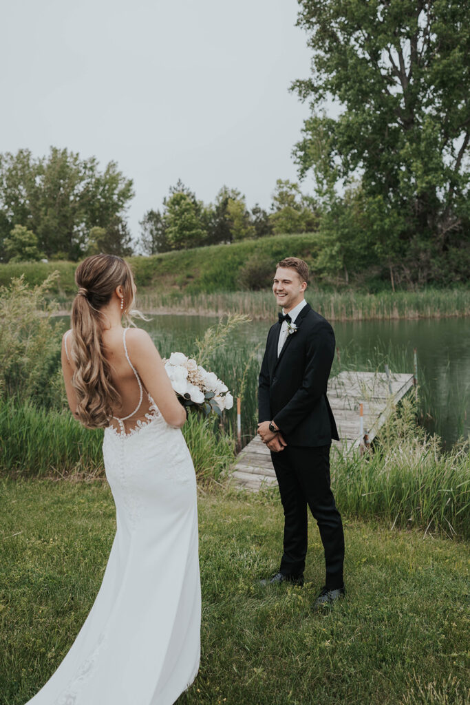 emotional bride and groom wedding first look