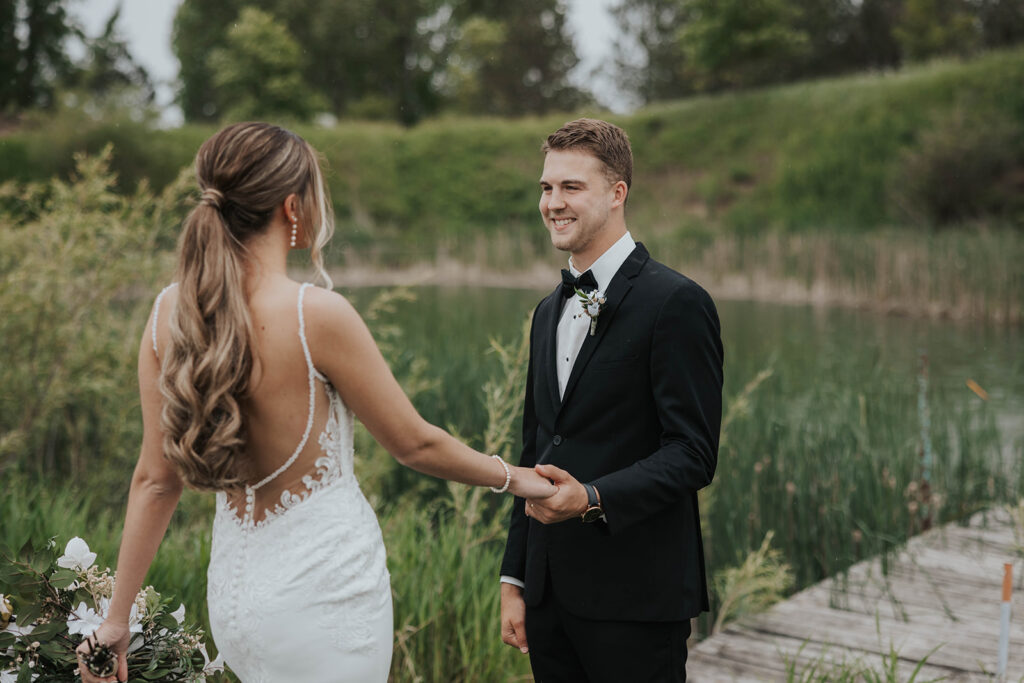 emotional bride and groom wedding first look