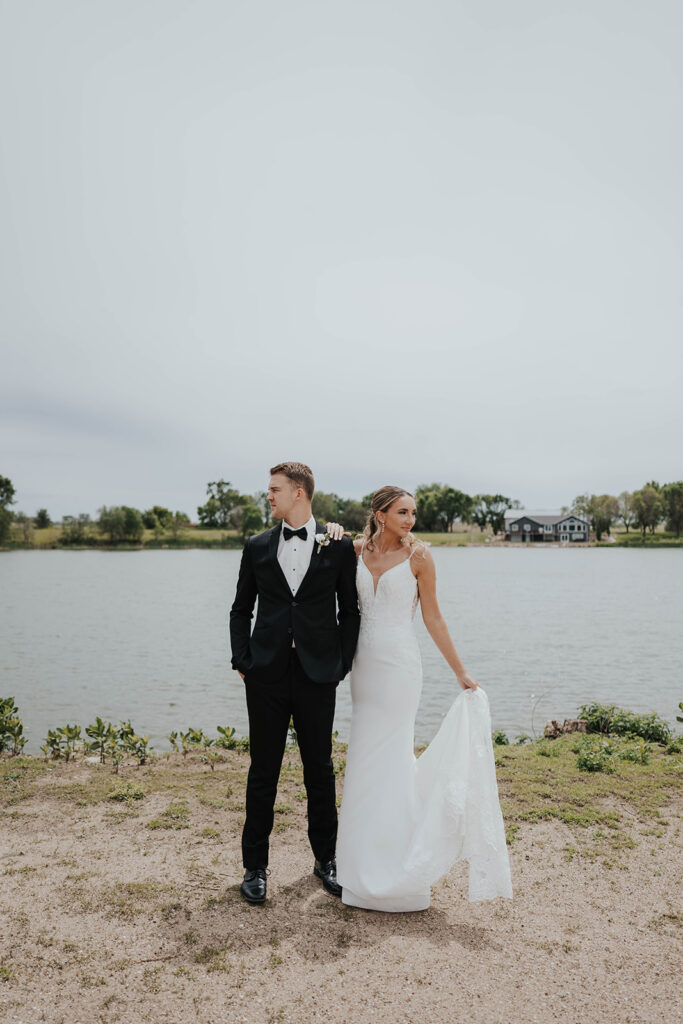 romantic bride and groom photo with water in the backdrop