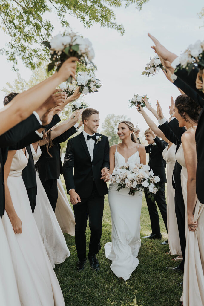 bride and groom surrounded by their bridal party