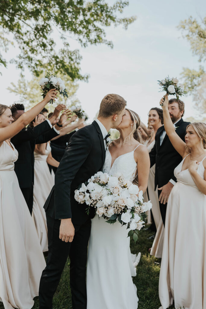 bride and groom surrounded by their bridal party