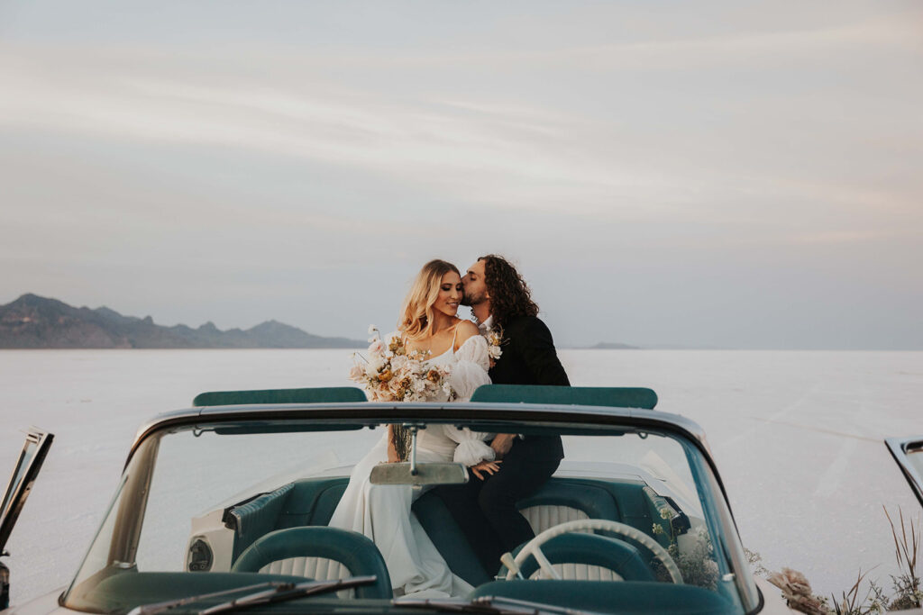 bride and groom in a vintage car at one of the best elopement destinations