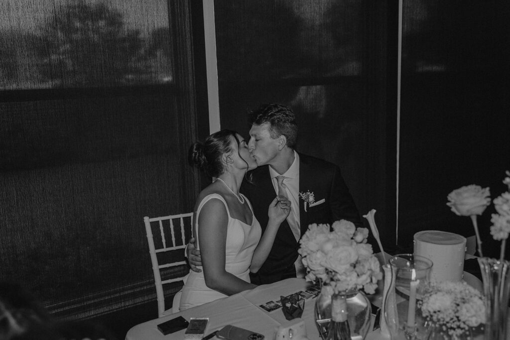 bride and groom kissing during their destination elopement wedding reception