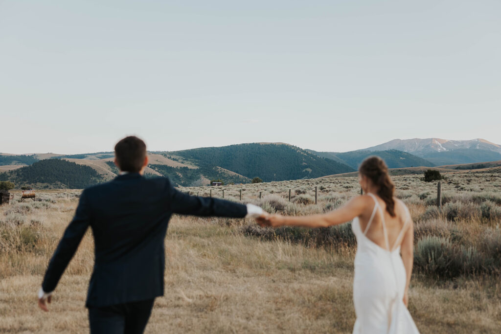 beautiful bride and groom destination elopement wedding photos with a mountain view in Montana