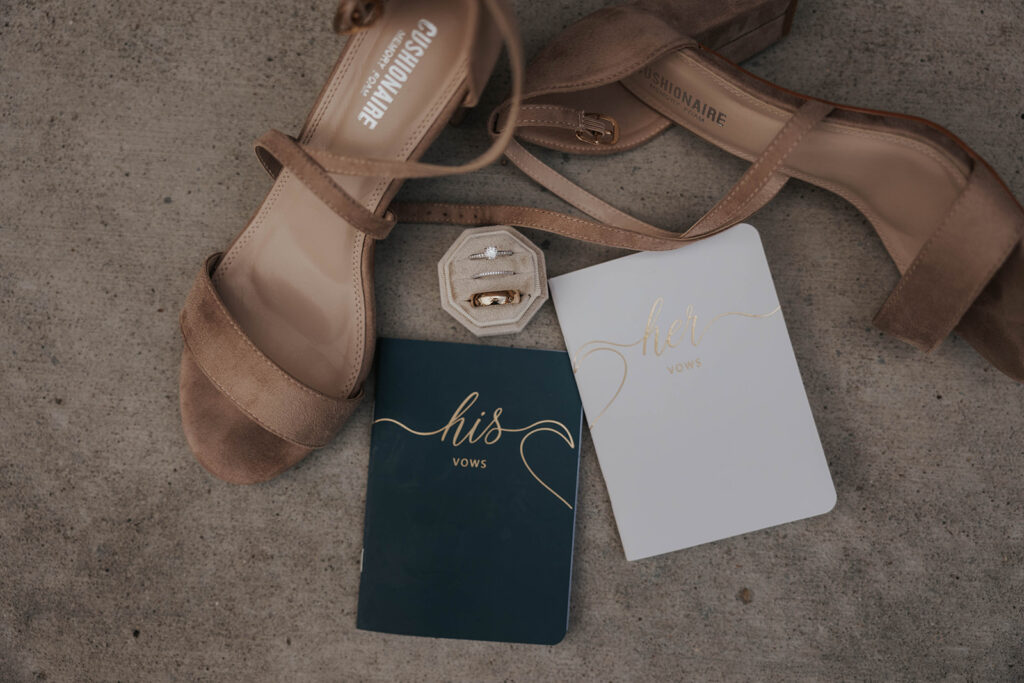 classy timeless wedding detail flatlay of shoes, bouquet, loose florals