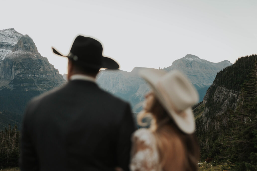 Couple admiring the mountain view in Glacier National Park