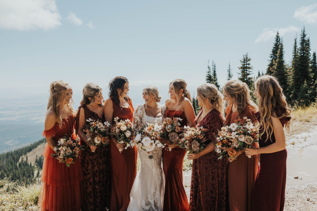 Bridesmaids with bouquets at Whitefish Mountain Resort