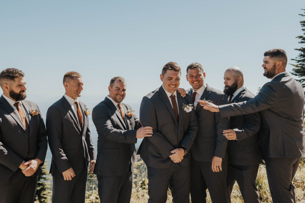 Groomsmen standing together at Whitefish Mountain Resort