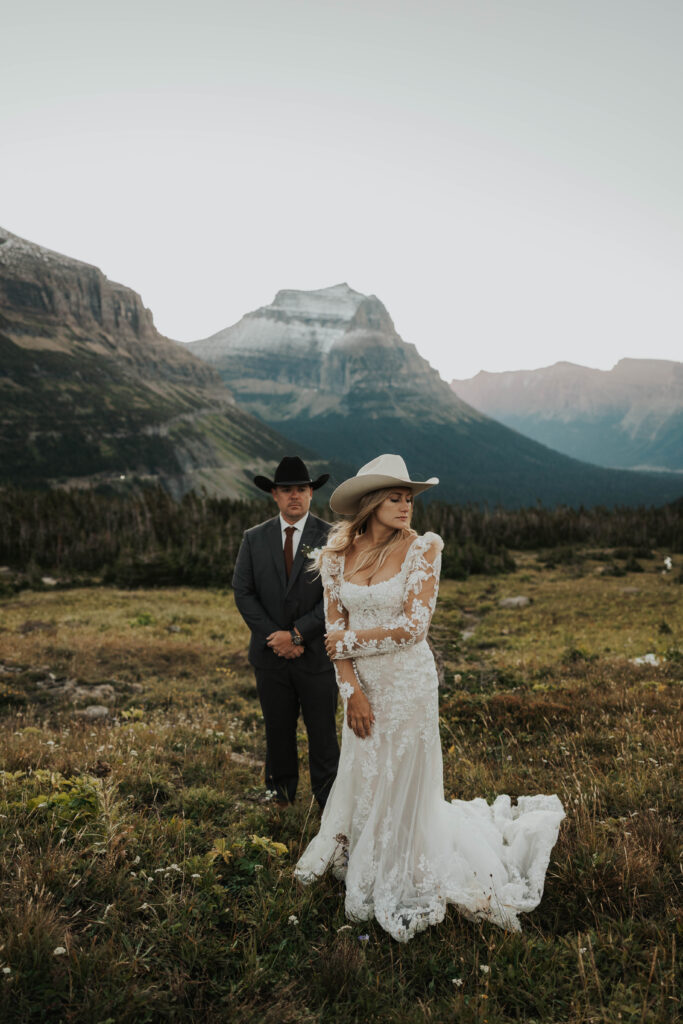 Elegant couple in front of mountain view at Glacier National Park