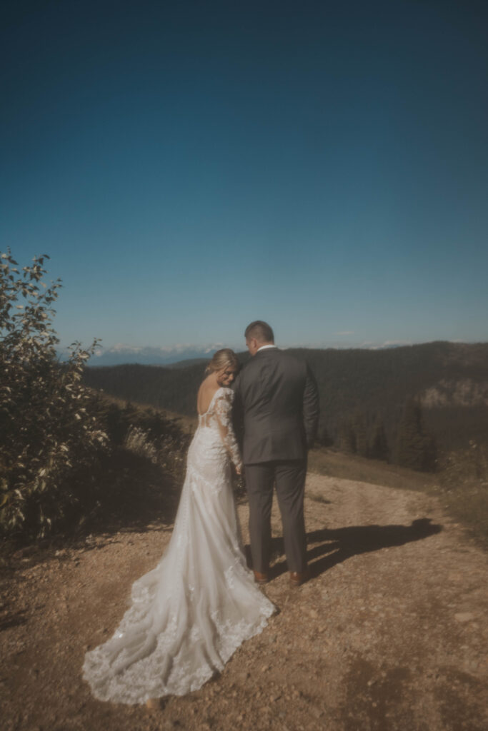 Couple in front of a mountain view at Whitefish Mountain Resort