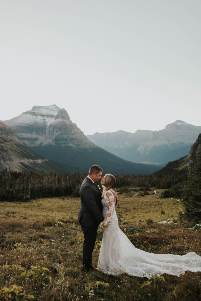 A couple standing together for their wedding in Glacier National Park