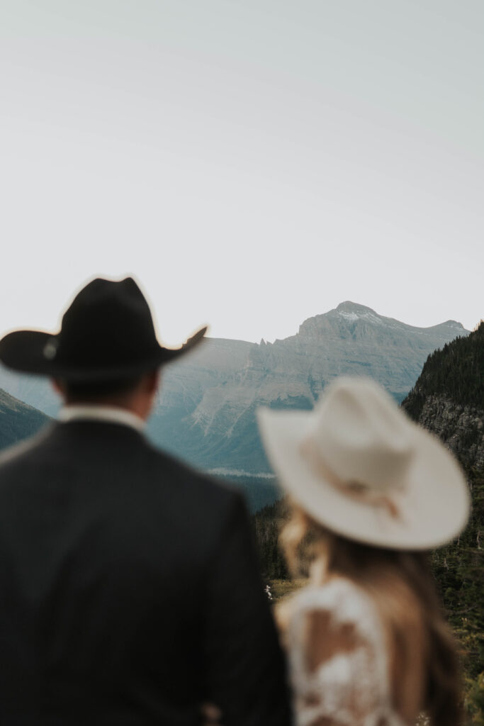 Couple looking at mountains in Glacier National Park